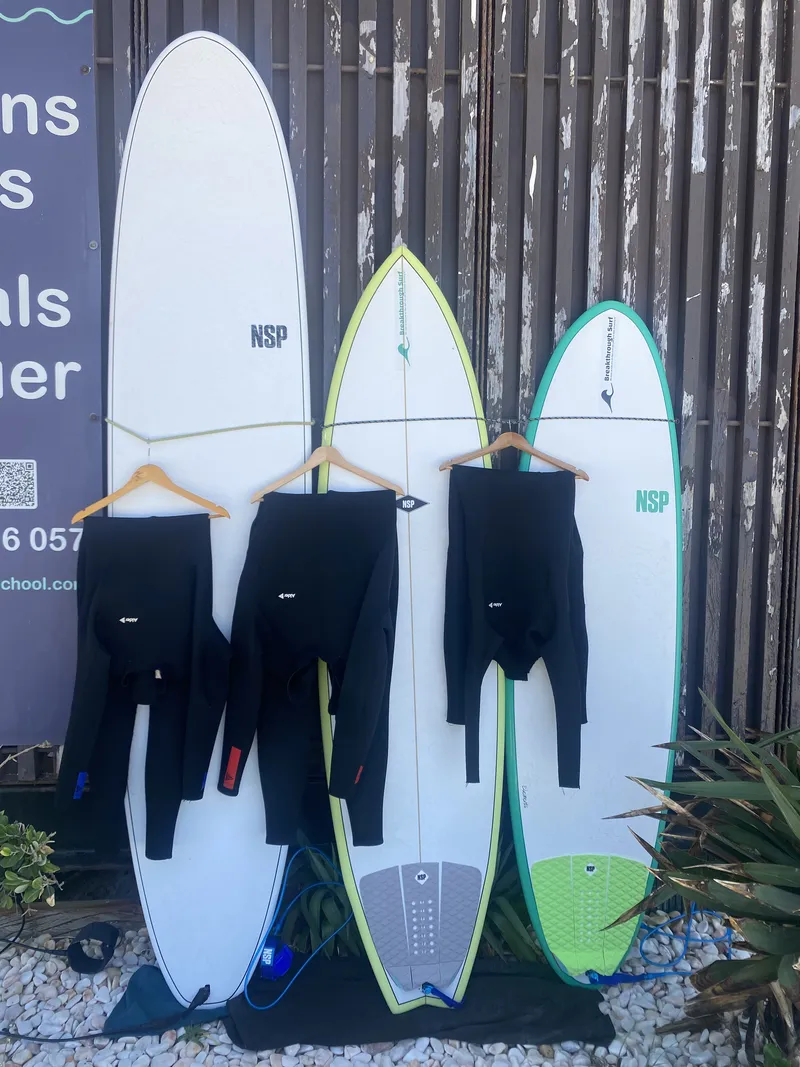 Hard-Board surfboard plus wetsuit for surf rentals and surf lessons at Breakthrough Surf School in Costa da Caparica, Portugal, near Lisbon
